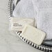 A white Dial Marble Basics bar soap on a metal dish.