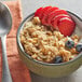 A bowl of Walnut Creek Country Lane Granola with strawberries and blueberries.