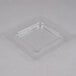 A clear square plastic lid for a Cambro container.