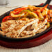 A pan of Gardein Plant-Based Chick'n Strips and vegetables.