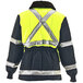 A RefrigiWear Iron-Tuff jacket in lime and navy with reflective stripes.