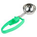 A Zeroll green and silver ice cream scoop with a green handle.