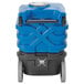 A blue and black plastic Powr-Flite carpet extractor container with black handles.