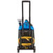 A blue and black Powr-Flite carpet spotter with a yellow cable.