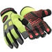A pair of lime green and black RefrigiWear insulated gloves.