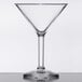 A clear plastic martini glass with a stem.