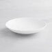 An Acopa Cordelia bright white porcelain bowl on a white background.