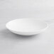 An Acopa Cordelia bright white porcelain bowl with an embossed design on a white background.