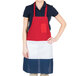 A woman wearing a red, white, and blue striped Intedge bib apron.