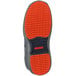 The orange Tingley Flite Safety non-slip outsoles of a shoe.