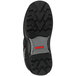 A close up of the black Tingley Flite Safety boot with a cleated outsole and red logo.