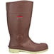 A brown Tingley Premier knee boot with a white sole.