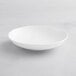 An Acopa Cordelia bright white porcelain bowl on a white background.