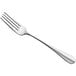 An Amefa stainless steel table fork with a silver handle.