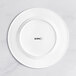 An Acopa Cordelia white porcelain plate with black embossed text on a white background.