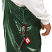A person wearing green Tingley Iron Eagle overalls with a patch pocket.