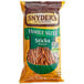 A bag of Snyder's of Hanover Pretzel Sticks in a bowl.