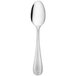 A stainless steel dessert spoon with a handle.