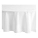 A white Choice 132" round cloth table cover on a table.