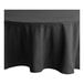 A black Choice round table cloth on a table.