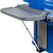 A navy blue Cambro end table on a grey plastic table with a tray on top.