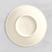 A white porcelain espresso saucer with a circular edge.