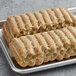 Field Roast plant-based apple maple breakfast sausage links on a tray.