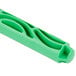 A green curved plastic handle with a hole in it.