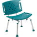 A teal plastic shower chair with metal legs.