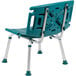 A teal plastic chair with silver legs.