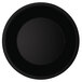 A close-up of a black plate with a wide rim.