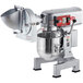 An Avantco 10 Qt. stand mixer with attachments and a guard.