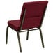 A burgundy Flash Furniture church chair with a gold vein metal frame.