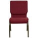 A burgundy Flash Furniture church chair with a metal frame.