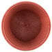 A close up of a red polyethylene ramekin.