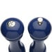 Two cobalt blue Chef Specialties salt and pepper mills with a silver lid.