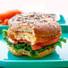A Rebellyous Kickin' Chicken patty sandwich on a plate.