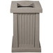 A grey rectangular Wausau Tile cigarette ash receptacle with vertical lines.