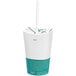 A white SOFi paper cold cup with a green lid and straw.