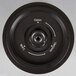 A circular black and white button with text reading "Vacuum" and arrows.