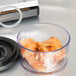 A close up of a bowl of chicken meat stored in an ARY VacMaster vacuum canister.