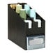 A black Cal-Mil countertop organizer holding cups and napkins.