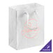 A white customizable paper bag with ribbon handles.