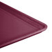 A close-up of a large purple Cambro dietary tray.