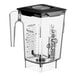 A clear Blendtec blender jar with a black latching lid.