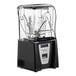 A black and silver Blendtec Connoisseur 825 blender with a clear plastic WildSide+ jar on a counter.