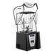 A black and grey Blendtec Connoisseur blender with a clear container and sound enclosure.