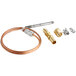 A Robertshaw copper and brass thermocouple with connectors.