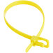 A yellow plastic cable tie with a clip.