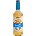 A Torani Puremade Zero Sugar S'mores flavoring syrup bottle with a blue label.